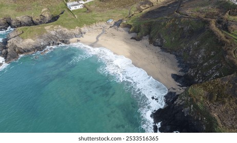 Aerial view of a secluded beach surrounded by rocky cliffs and clear turquoise waters. - Powered by Shutterstock