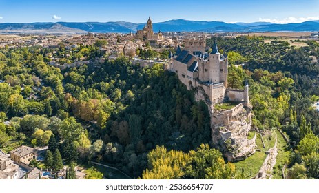 Aerial view of the Alcázar of Segovia, a medieval castle built on a rocky crag in Castile and León, Spain - Powered by Shutterstock