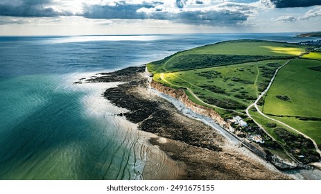 Aerial view of Seven sisters cliffs and Ocean, on a sunny day, a famous tourist location, East Sussex, UK - Powered by Shutterstock