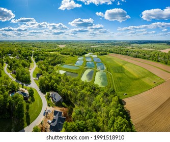 Aerial View Of Sewage Treatment Lagoons And A Residential Neighborhood Near Georgetown, Kentucky