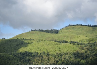 Aerial view of sharp limestone mountains,Thailand.Limestone mountains have a lot of limestone. Behind the blue sky and white clouds.selective focus.Nature ,Green Nature Landscape.Selective focus.
