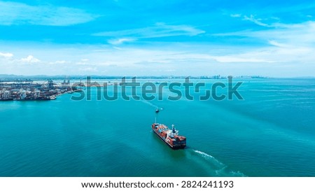 Aerial view of shipping systems, containerized cargo ships, and cargo ships entering international ports. Export-import business, logistics, and transportation industry concepts.