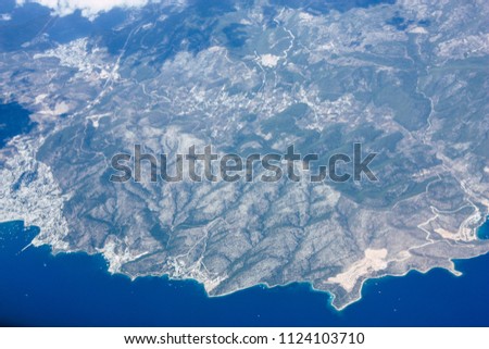 Aerial view of the shores of the Mediterranean Sea at 10,000 feet altitude in the afternoon