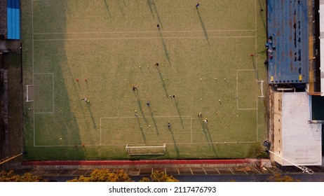 Aerial View Showing Kids Playing Soccer At Field During Sunset In Buenos Aires