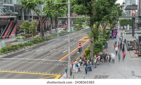 Aerial view of sidewalk and intersection of Orchard road in Singapore timelapse. Orchard road is one of best shopping district in Singapore. - Powered by Shutterstock