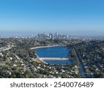 Aerial view of Silver Lake reservoir with downtown Los Angeles skyline