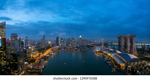 Aerial View Of Singapore Business District And City At Night In Singapore, Asia. Asia Tourism, Modern City Life, Or Business Finance And Economy Concept