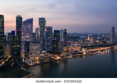 Aerial view of Singapore downtown district skyline by the marina bay in Singapore in Southeast Asia. The city is a major financial center in Asia