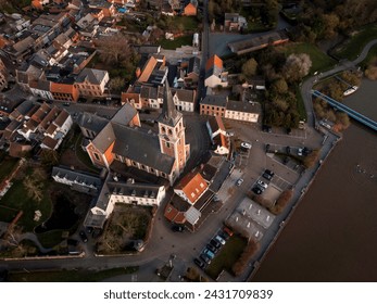 Aerial view of Sint-Amandus Church, on the shore of the Scheldt river