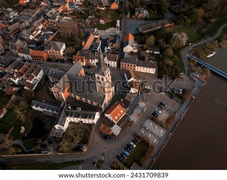 Aerial view of Sint-Amandus Church, on the shore of the Scheldt river