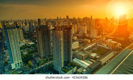 Aerial View Of Sky Scraper In Heart Of Bangkok Thailand Capital With Beautiful Sun Light Over Sky