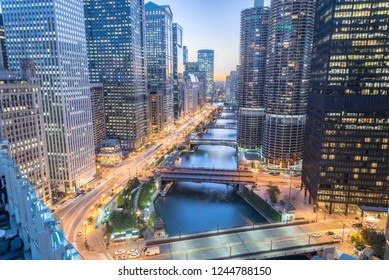 Aerial View Of Skyline Along Chicago River Through Downtown At Sunset