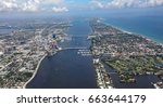 Aerial view of the skyline of West Palm Beach, Florida, and the island of Palm Beach on the other side of the Lake Worth Lagoon.