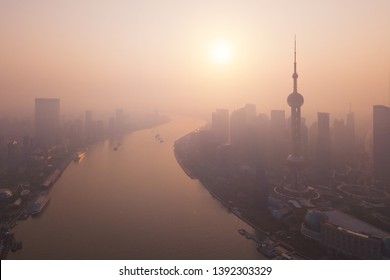 Aerial View Of Skyscraper And High-rise Office Buildings In Shanghai Downtown With Fog, China. Financial District And Business Centers In Smart City In Asia At Sunrise.