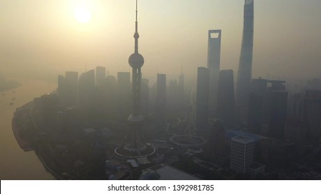 Aerial View Of Skyscraper And High-rise Office Buildings In Shanghai Downtown With Fog Or Mist, China. Financial District And Business Centers In Smart City In Asia At Sunrise.