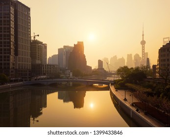 Aerial View Of Skyscraper And High-rise Office Buildings In Shanghai Downtown With Fog Or Mist, China. Financial District And Business Centers In Smart City In Asia At Sunrise.