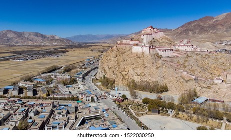 Aerial view of a small city in Tibet, aerial capture of the City of Xigaze, Tibet, China.  Shigatse is the second largest city of tibet. the castle or Dzong from the sky 