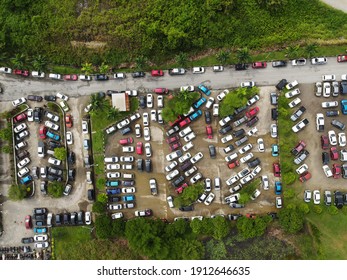 Aerial View Of Small And Crowded Car Park Parking Lot With Automobiles Or Vehicles At Sarawak, Malaysia, Southeast Asia.