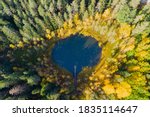 Aerial view of small forest lake Haransilma in Lahti, Finland. The diameter of lake is about 50 meters.