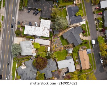 Aerial View. Small Green City, Suburb. Roofs Of One-story Houses, Outbuildings. There Are No People In The Photo. Map, Planning, Topography, Construction Industry, Ecology, Geography.