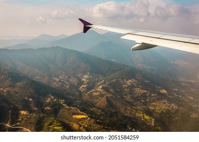 Aerial View For Small Nepal Villages From The Airplane Porthole, The Plane Is Landing. Travel Concept