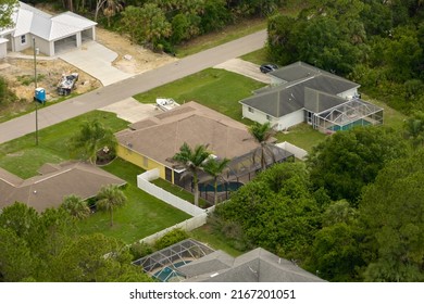 Aerial View Of Small Town America Suburban Landscape With Private Homes Between Green Palm Trees In Florida Quiet Residential Area