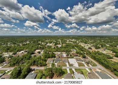 Aerial View Of Small Town America Suburban Landscape With Private Homes Between Green Palm Trees In Florida Quiet Residential Area