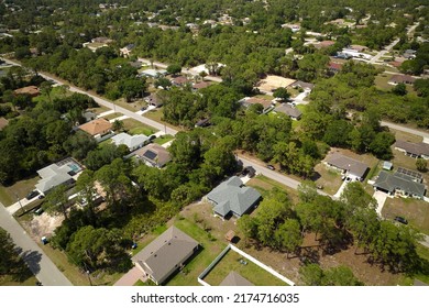 Aerial View Of Small Town America Suburban Landscape With Private Homes Between Green Palm Trees In Florida Quiet Residential Area