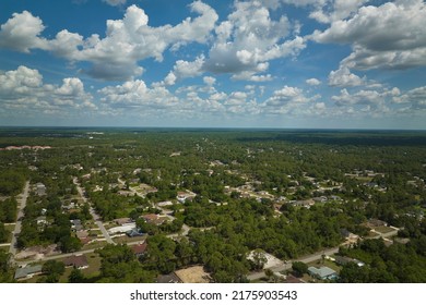 Aerial View Of Small Town America Suburban Landscape With Private Homes Between Green Palm Trees In Florida Quiet Residential Area