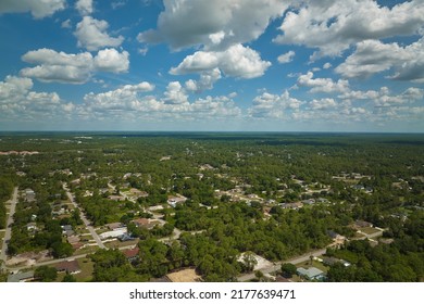 Aerial View Of Small Town America Suburban Landscape With Private Homes Between Green Palm Trees In Florida Quiet Residential Area