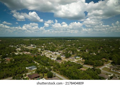 Aerial View Of Small Town America Suburban Landscape With Private Homes Between Green Palm Trees In Florida Quiet Residential Area