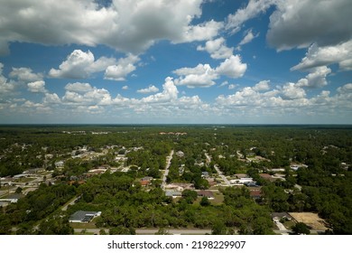 Aerial View Of Small Town America Suburban Landscape With Private Homes Between Green Palm Trees In Florida Quiet Residential Area