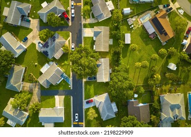 Aerial View Of Small Town America Suburban Landscape With Private Homes Between Green Palm Trees In Florida Quiet Residential Area