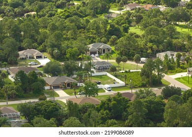 Aerial View Of Small Town America Suburban Landscape With Private Homes Between Green Palm Trees In Florida Quiet Residential Area