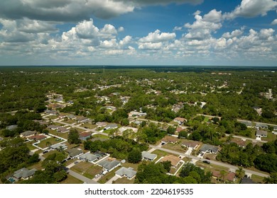 Aerial View Of Small Town America Suburban Landscape With Private Homes Between Green Palm Trees In Florida Quiet Residential Area