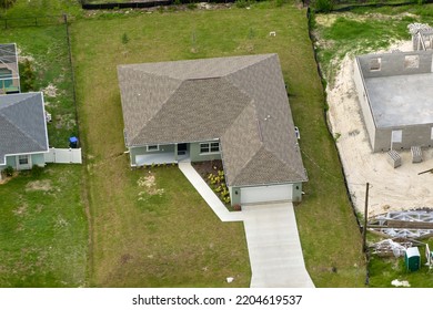 Aerial View Of Small Town America Suburban Landscape With Private Homes Between Green Palm Trees In Florida Quiet Residential Area