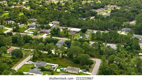 Aerial View Of Small Town America Suburban Landscape With Private Homes Between Green Palm Trees In Florida Quiet Residential Area