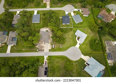 Aerial View Of Small Town America Suburban Landscape With Private Homes Between Green Palm Trees In Florida Quiet Residential Area