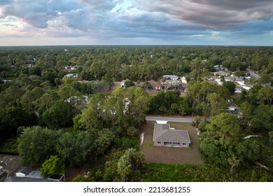 Aerial View Of Small Town America Suburban Landscape With Private Homes Between Green Palm Trees In Florida Quiet Residential Area