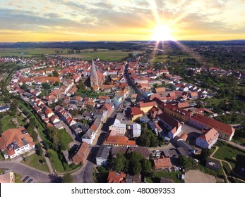 Aerial View Of A Small Town With Church In Sunset In Germany