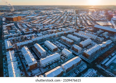 Aerial View of Snow Covered Buildings in Baltimore City at Sunset in Winter