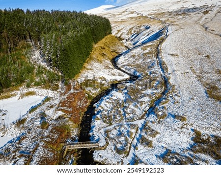 Aerial view of the snow covered path from Pont-ar-Daf to the summit of Corn Du and Pen-y-Fan in the Brecon Beacons