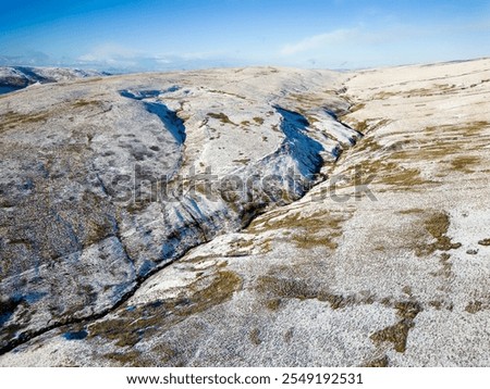 Aerial view of the snow covered path from Pont-ar-Daf to the summit of Corn Du and Pen-y-Fan in the Brecon Beacons