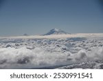 Aerial view of the snow-capped Mount Kilimanjaro above the clouds in Tanzania, Africa