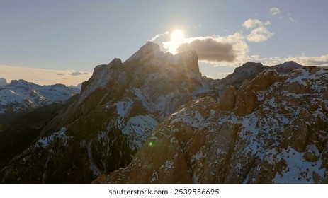 Aerial View of Snow-Capped Mountains at Sunset. - Powered by Shutterstock