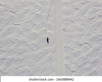 Aerial View Of A Snowmobile Parked Along The Trail