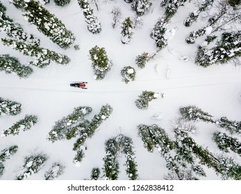 Aerial View Of Snowmobile In Snow Winter Day In Rural Finland, Lapland