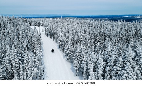 Aerial view of snowmobiler on trail - Powered by Shutterstock