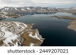 Aerial view of the Snowy Andes and Maule Lagoon at the Pehuenche border crossing between Chile and Argentina.