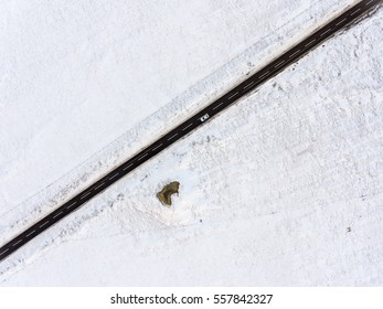 Aerial View Of Snowy Fields And Road